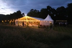 marquee tent lit up at night