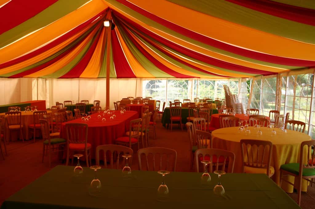 a marquee with tables and chairs
