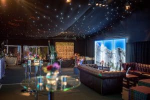 Marquee Furniture A marquee with a starcloth ceiling, bar, tables and chairs and other marquee theming elements